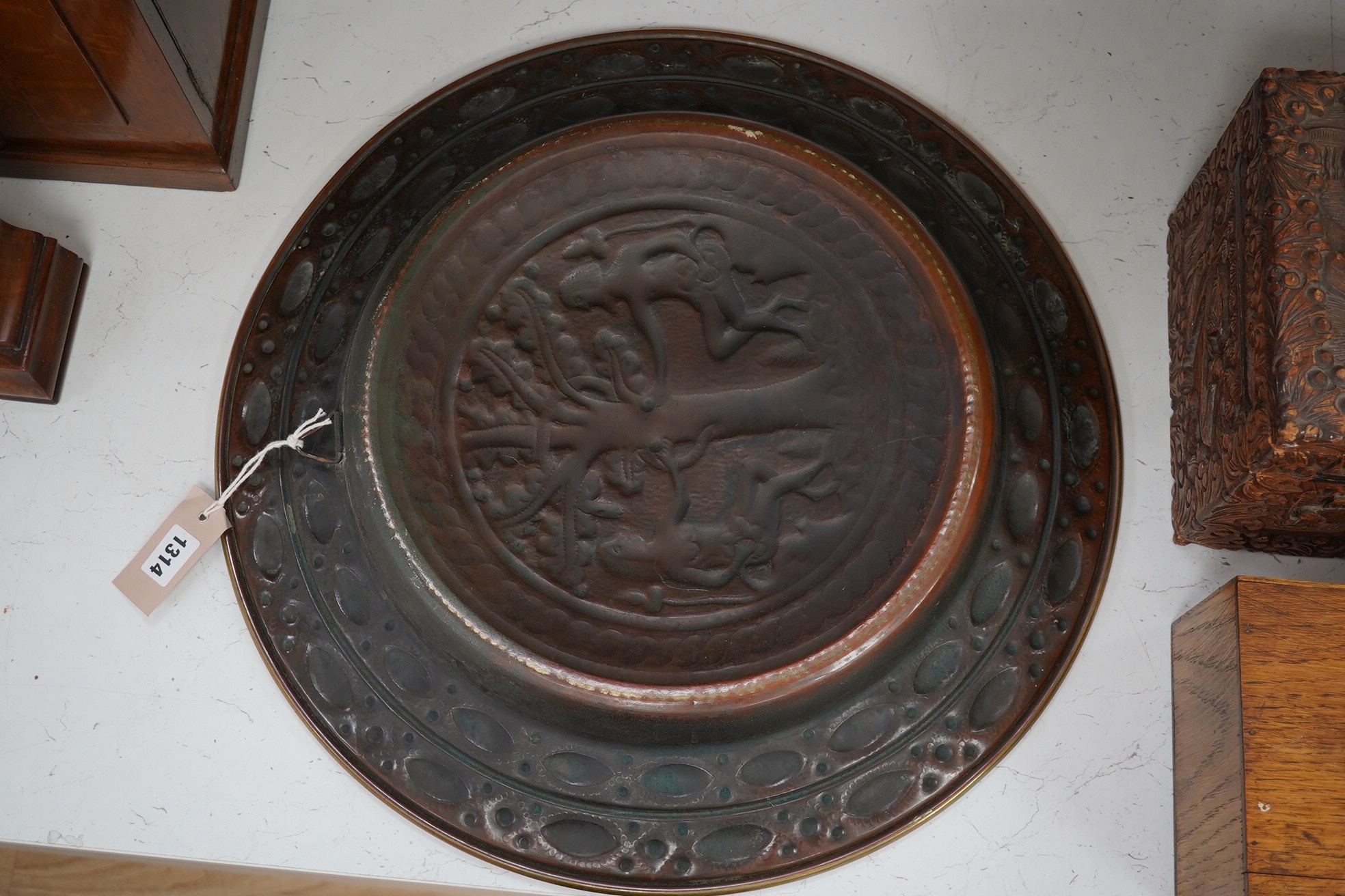 An 18th century German ‘Adam and Eve’ brass alms dish, 52cm diameter. Condition - good